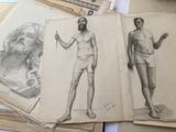two drawings of a man and a woman on a table