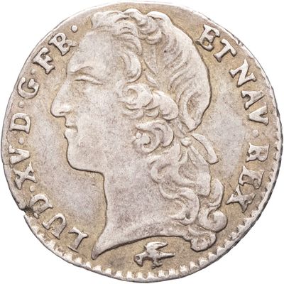 gros plan d'une pièce de monnaie sur laquelle figure une tête de femme