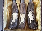 three bottles in a box with a horse on them