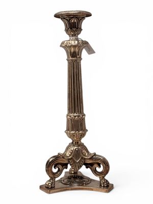 a close up of a metal candle holder on a white background