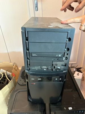 a black computer tower sitting on top of a black box