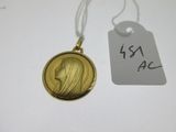 an image of a gold locke with a woman ' s face on it