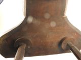 a close up of a wooden clock with a clock face on it
