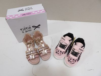 two pairs of shoes and a box on a table