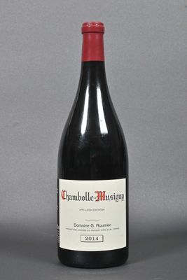 a bottle of wine that is sitting on a table