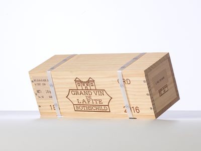 a wooden box with a label on it sitting on a table