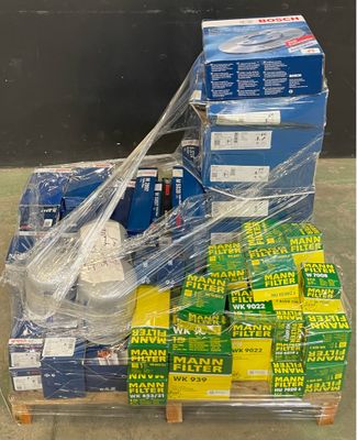 a pallet full of boxes of soda and a bag of soda