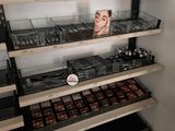 a lot of makeup products on the shelves in the store