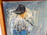 a painting of a man with a hat on a shelf