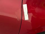 a sticker on the door of a red car