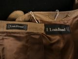 the back of a brown pants with a black label on it