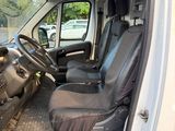 a white van with black seats and a steering wheel