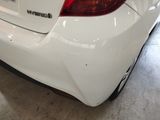 a white car that is parked in a garage