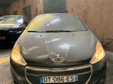 a grey car parked in a garage next to other cars