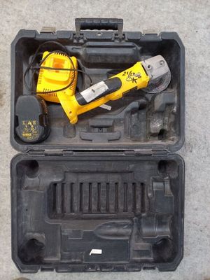 a tool in a case that is sitting on the ground