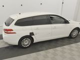 a picture of a white car parked in a garage