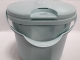 a blue plastic container with a lid on a white surface