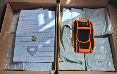 two boxes that have items inside of them in them
