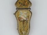 an image of a small box with flowers on it on a white surface