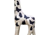 statue of a giraffe on a black base with a white background