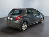 the back end of a grey car parked in a large room