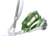 a close up of a green and white vacuum cleaner on a white background