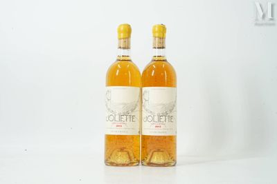 two bottles of wine sitting next to each other on a white surface
