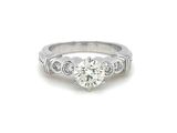 a close up of a diamond ring on a white background