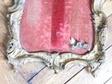 a picture of a picture of a mirror on a wooden floor