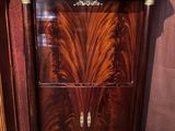 a cabinet that has a marble top on top of it