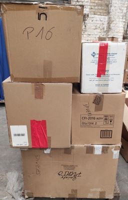 several cardboard boxes stacked on top of each other in a warehouse