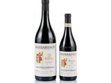 two bottles of wine sitting next to each other on a white surface