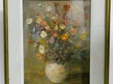 painting of a vase of flowers in a gold frame on a table