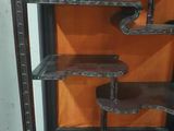 a wooden shelf with several shelves on top of it