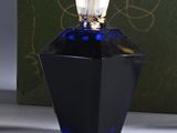 an image of a bottle of perfume sitting on a table next to a box