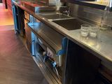 stainless steel counter top in commercial kitchen with stainless steel sink