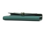 a green purse with a metal clasp on the front