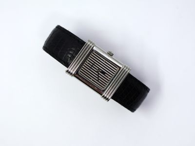 an image of a wrist watch on a white surface
