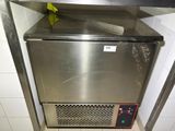 a stainless steel dishwasher in the corner of a kitchen