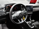 the interior of a car with a steering wheel and dashboard controls