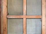 a wooden window with a glass pane in it