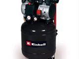 an image of a black air compressor sitting on top of a table