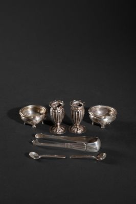 an assortment of silverware on a black background with a knife and spoon