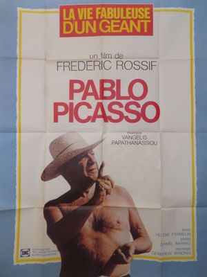 une vieille affiche de cinéma représentant un homme coiffé d'un chapeau et torse nu