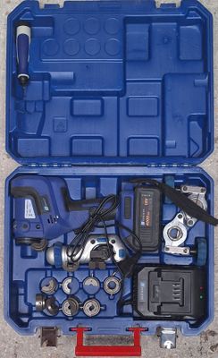 a blue tool case with tools in it on the ground