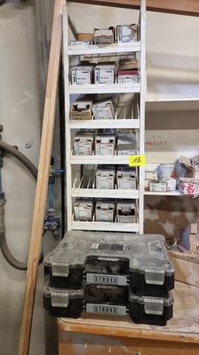 a lot of tools on a workbench in a garage
