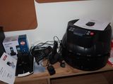 an image of a desk with a printer, cell phone, and other electronics