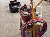an image of a gas cylinder cart with a hose attached to it