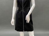 the mannequin is wearing a black dress with a zipper