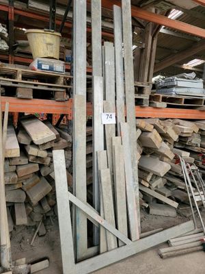 a large pile of wood in the middle of a warehouse